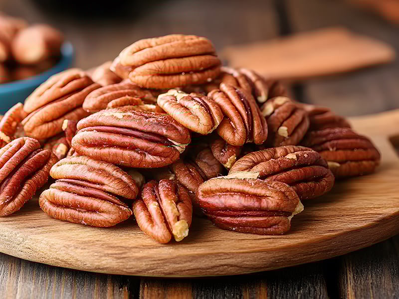 Crisp, shelled pecans displayed for snacking or cooking.